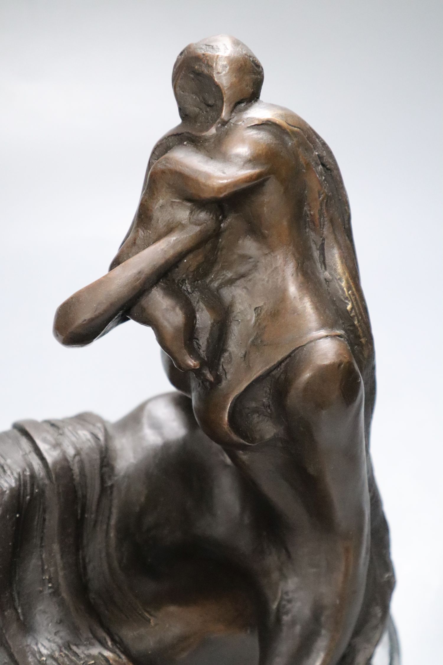 An abstract bronze of a mother and child, on marble base, indistinctly signed, height 26cm